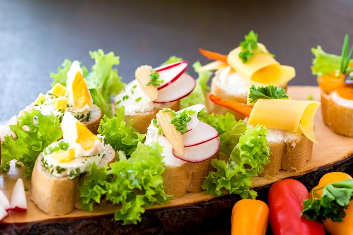 Appetizers with bread, cheese, and vegetables