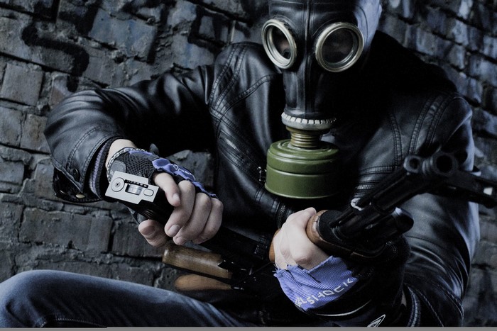 Man in gas mask with assault rifle