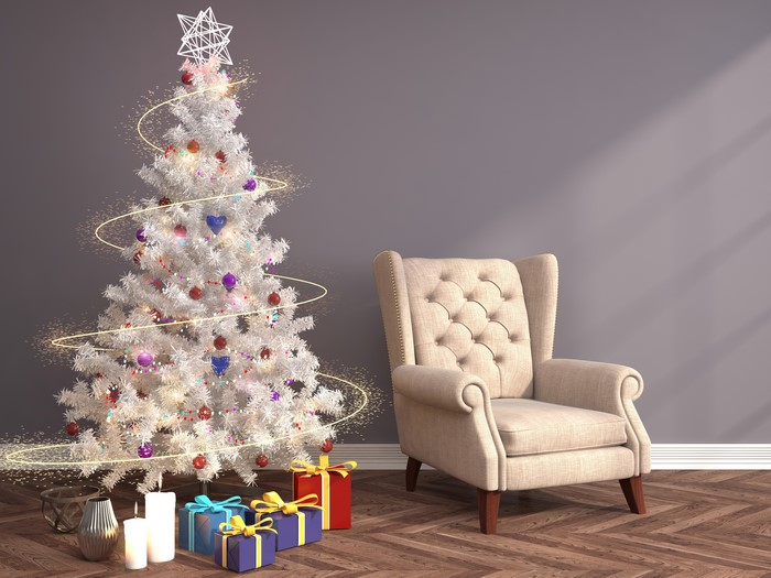 Christmas tree with gifts and armchair
