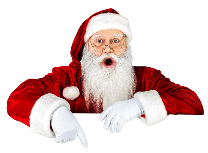 Santa Claus pointing down with a surprised expression