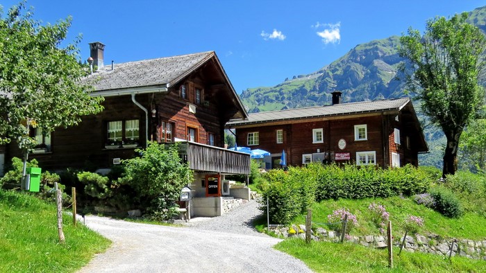 Wooden houses in Weissenberge, Switzerland with mountains