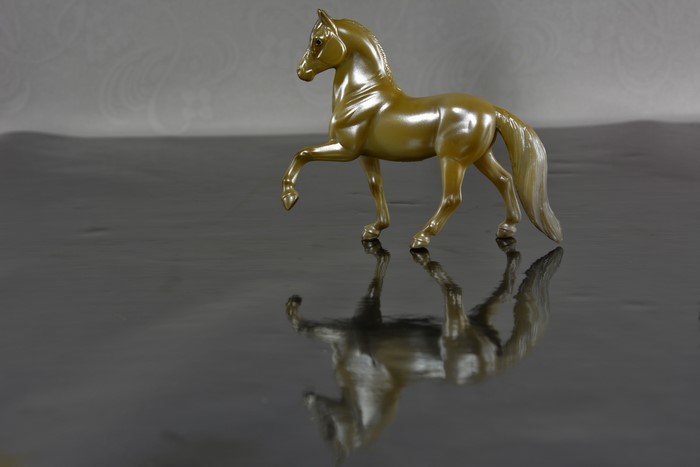 Gold Horse Toy with Reflection
