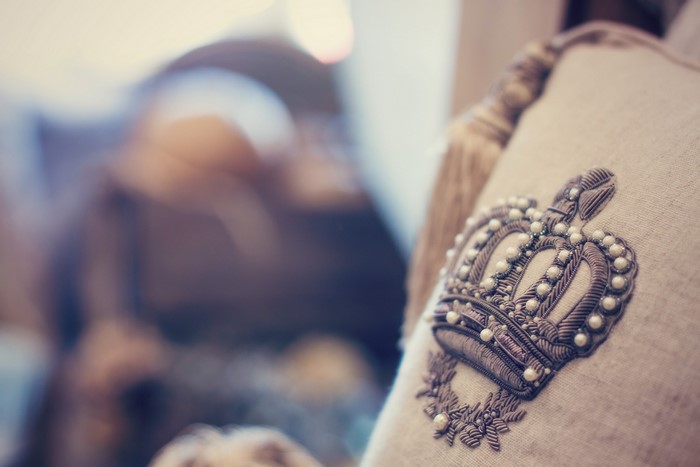 Close-up of a crown embroidery on a pillow