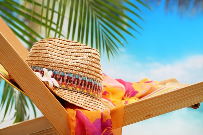 Straw hat and sarong on a beach chair