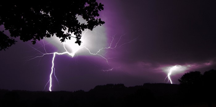 Lightning strikes during a thunderstorm at night