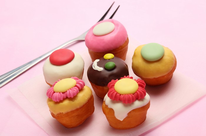 Little cakes with colorful frosting