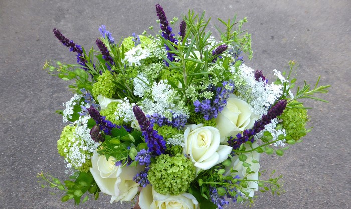 Bouquet of white roses, lavender, and green hydrangeas