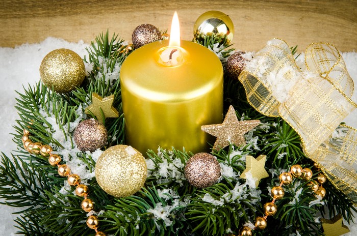 Christmas candle with fir branches and ornaments