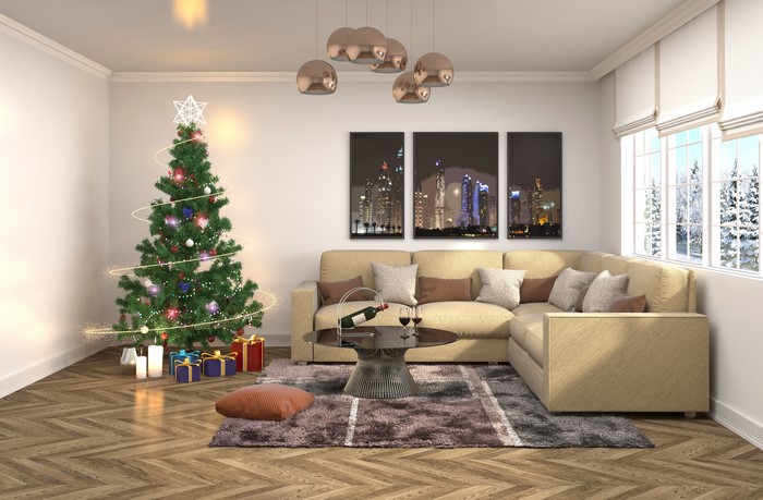Christmas interior with tree, sofa, and city art