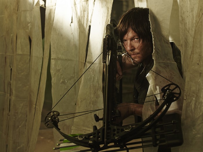 Norman Reedus as Daryl Dixon with crossbow from The Walking Dead