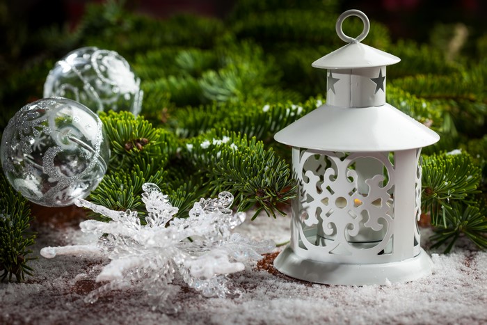 Christmas lantern with ornaments and fir branches