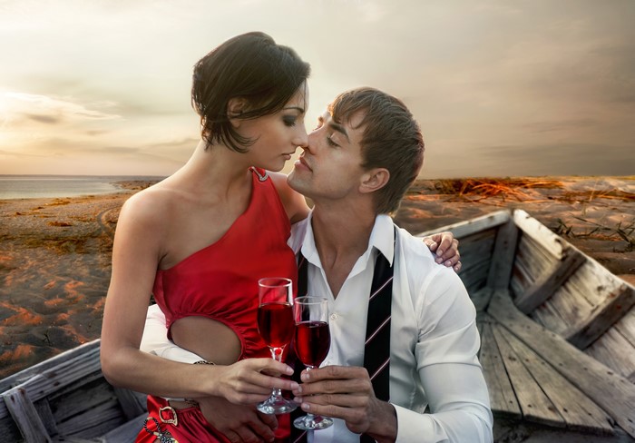 Couple in a boat with wine