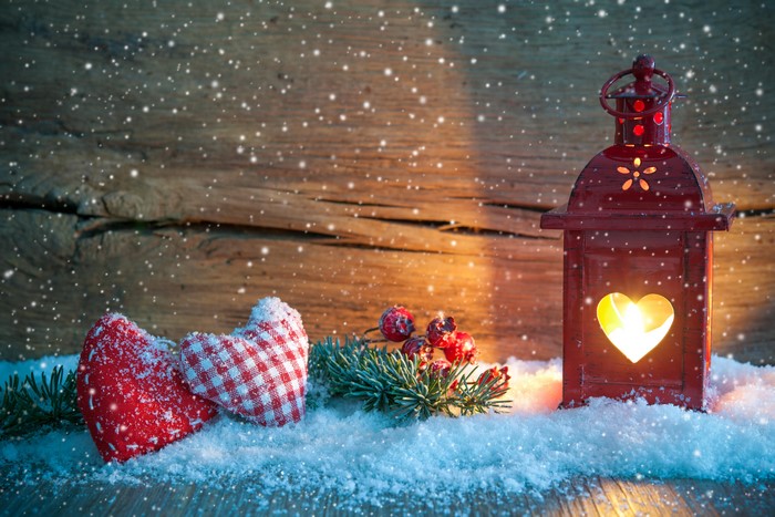 Christmas lantern with hearts and snow