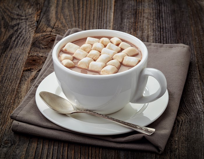 Hot chocolate with marshmallows in a cup with a spoon