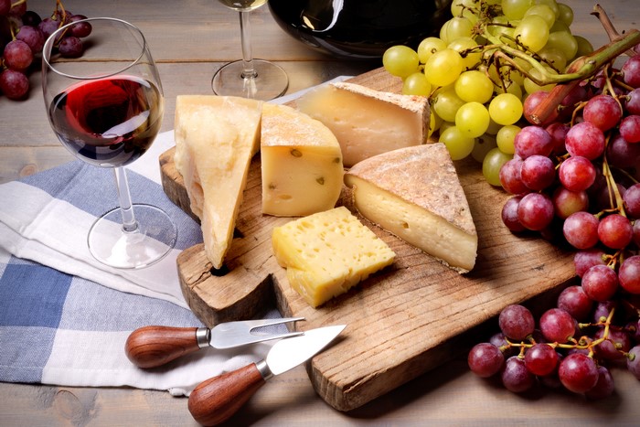 Cheese and Grapes with Red and White Wine