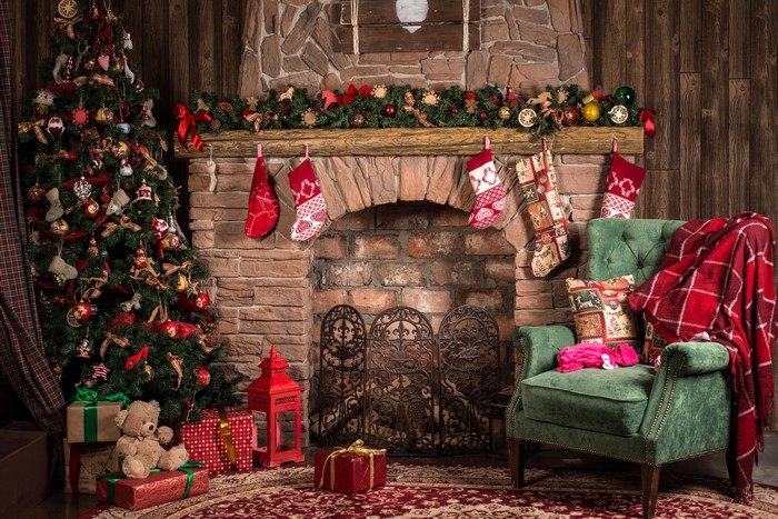 Christmas tree and fireplace with stockings and gifts