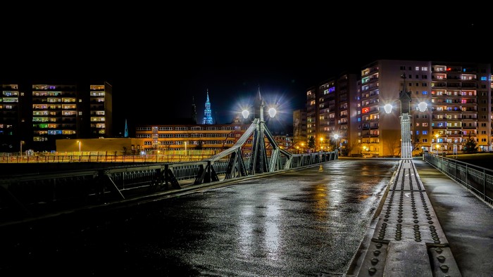 Bridge at night in Zwickau, Germany with apartment buildings