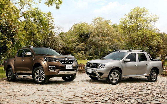 Two Renault Alaskan pickup trucks parked outdoors