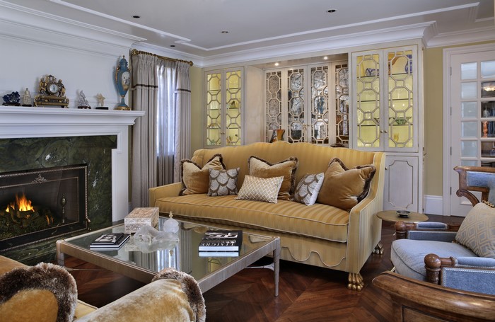 Living room with fireplace, sofa, and cabinets