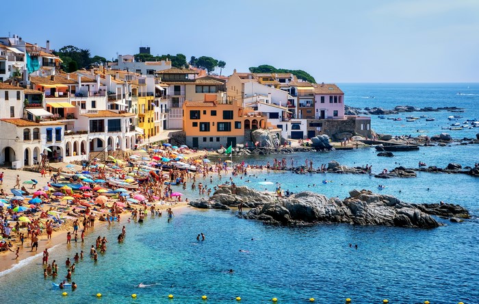 Calella de Palafrugell, Catalonia, Spain beach with houses and people