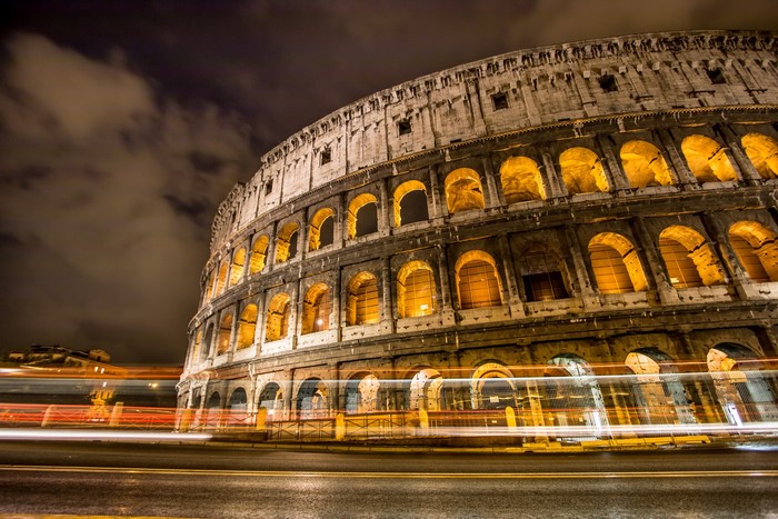 Colosseum at Night with Light Trails in Rome, Italy