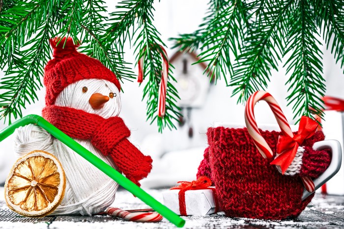 Christmas snowman with candy canes and a mug