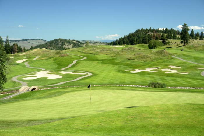 Golf course with rolling hills and sand traps