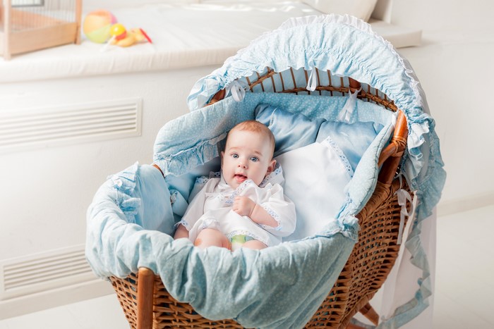 Baby in a wicker bassinet