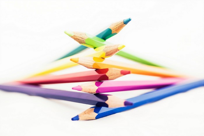 Stack of colorful pencils on a white background
