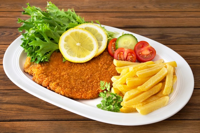 Schnitzel with French Fries, Lemon, and Salad