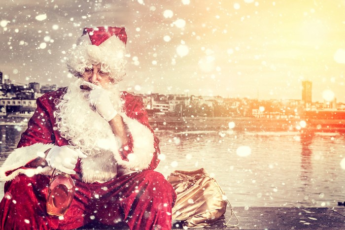 Santa Claus with cigar and whiskey bottle