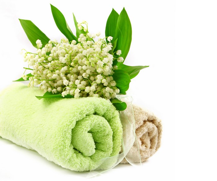 Lily of the valley flowers with rolled towels