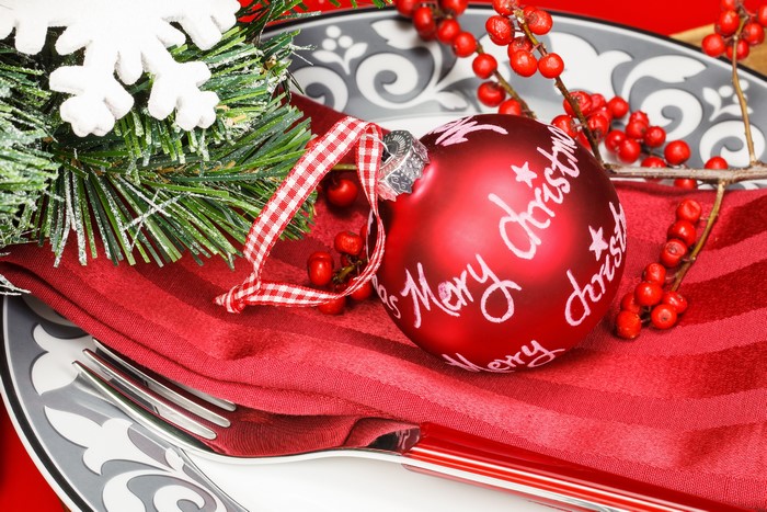 Christmas table setting with ornament and pine