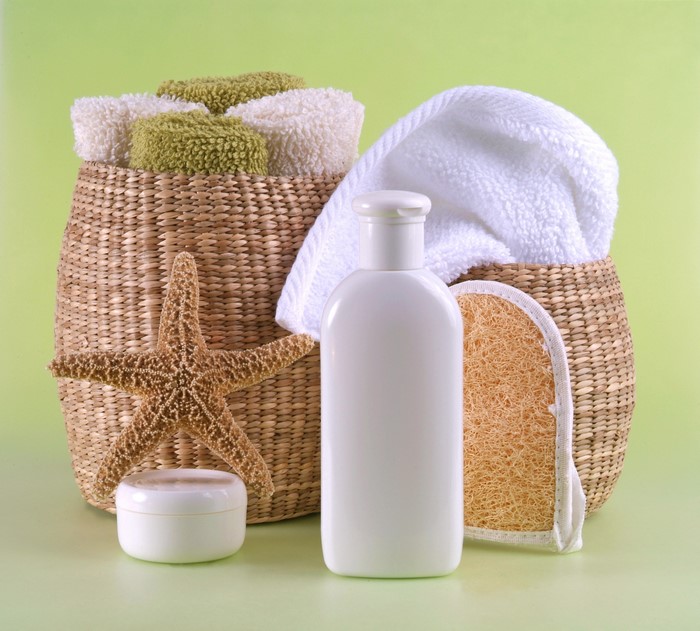 Spa items with starfish and towels in a wicker basket