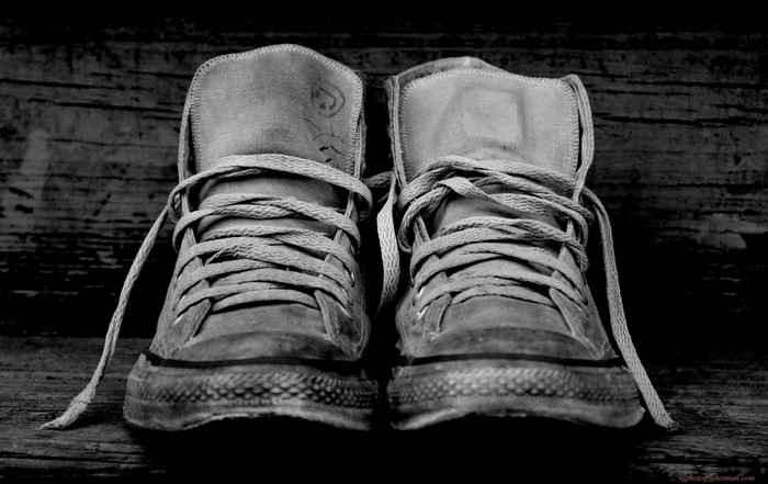 Pair of Converse plimsoll shoes with shoelaces