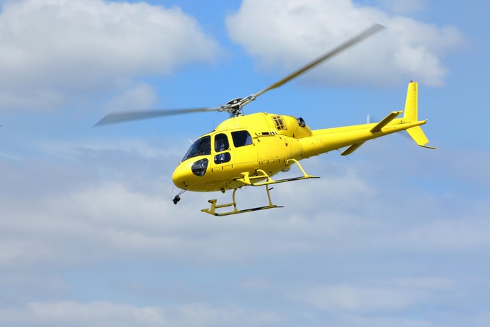 Yellow Helicopter Flying in the Sky