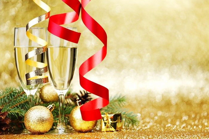 Champagne Glasses with Christmas Decorations and Ribbons