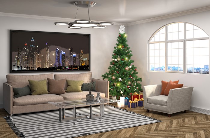 Living room with Christmas tree and city skyline painting