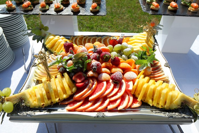 Fruit platter with strawberries, citrus, and pineapple