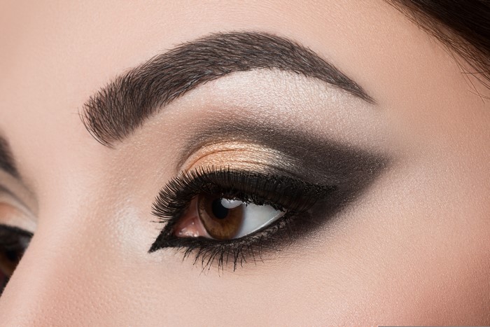 Close-up of a woman's eye with dramatic makeup