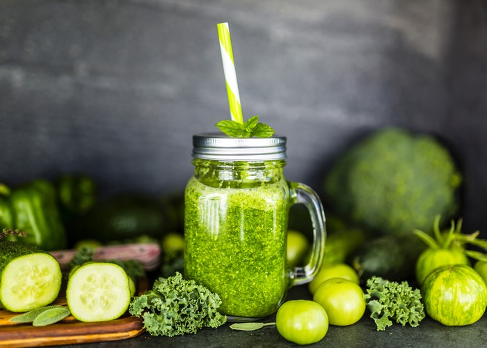 Green smoothie in a jar with vegetables