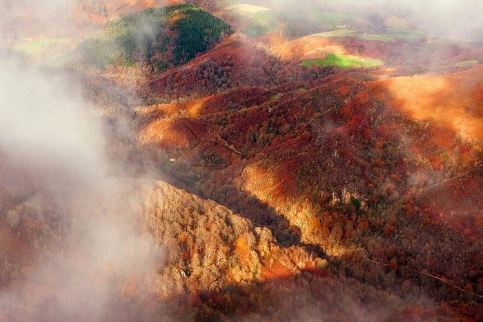 Autumn mountains in Navarra, Spain, seen from above with fog
