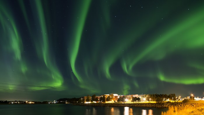 Aurora Borealis over a town at night