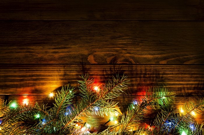 Christmas Branches with Fairy Lights on Wood