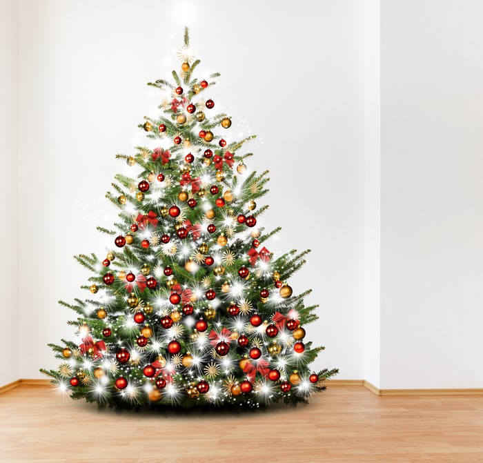 Christmas tree with red and gold ornaments and fairy lights