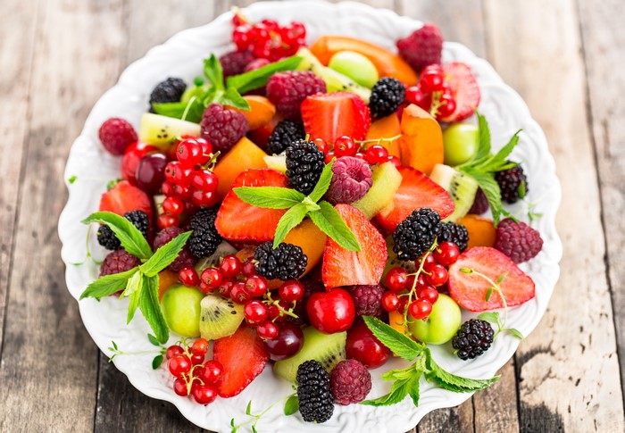 Fruit Salad with Berries and Mint on a Plate