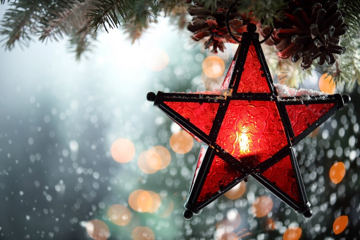 Red Star Decoration with Candle on Christmas Tree