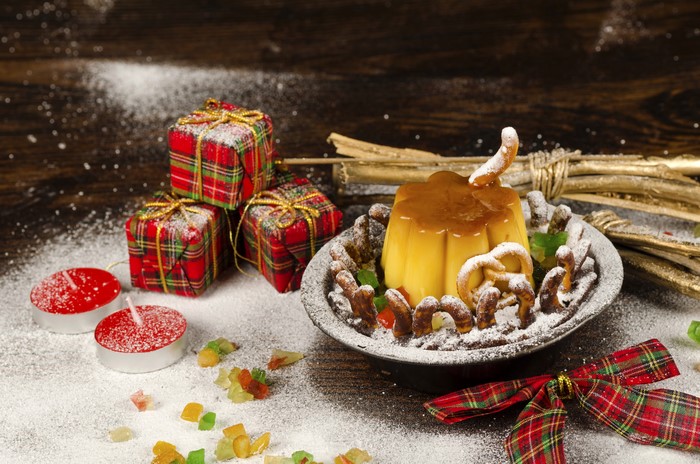 Christmas dessert with gifts and candles