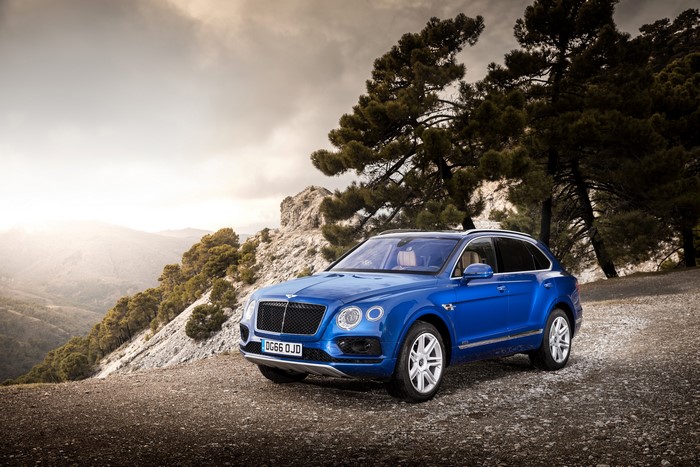 Blue Bentley Bentayga Diesel SUV on Mountain Road