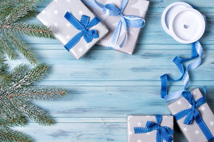 Christmas Gifts with Blue Ribbon and Pine Branches